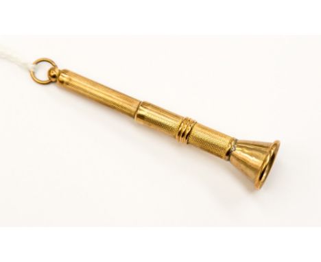 A 9ct watch chain with elongated alternative links suspending a pair of 9ct engine turned tools (toothpick, etc) together wit