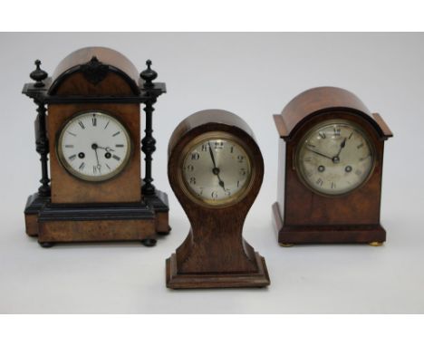 A walnut and ebonised mantle clock, with a maple mantle clock, and a waisted oak mantle clock 