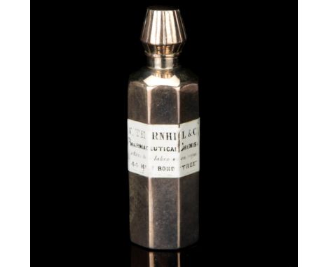 A Silver Medicine Bottle, with enamel label reading ‘W Thornhill & Co Pharmaceutical Chemist, mixture to be taken when requir