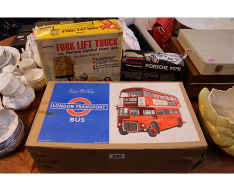 Boxed Tudor Rose London Transport Bus, Boxed Fork lift Truck by Palitoy and a boxed Motora-Wave Radio Controlled Porsche 