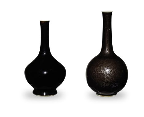 TWO MIRROR-BLACK-GLAZED LONG-NECKED BOTTLE VASESKangxiOne vase with a pear-shaped profile rising from a  slightly splayed foo