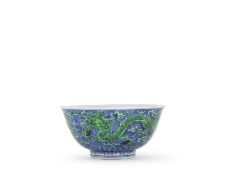 A VERY RARE GREEN-ENAMELLED BLUE-GROUND 'DRAGON' BOWLKangxi six-character mark and of the periodThe exterior all reserved on 