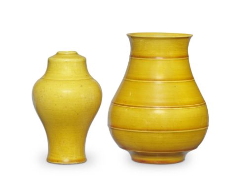 TWO YELLOW-GLAZED VASES18th centuryA pear-shaped vase under a rich slightly dark yellow-caramel glaze moulded with five horiz