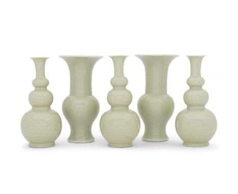 A RARE GARNITURE OF FIVE INCISED CELADON-GLAZED VASESKangxiComprising three triple-gourd vases with trumpet neck and two yen 