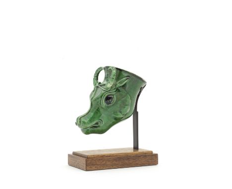 AN UNUSUAL GREEN-GLAZED WATER BUFFALO RHYTON CUPKangxiCrisply and thinly potted all under a rich apple-green glaze with a hal