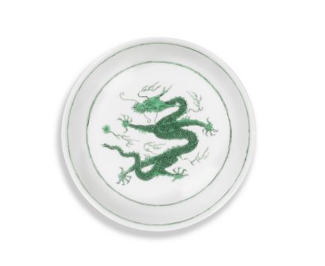 A RARE GREEN-ENAMELLED INCISED 'DRAGON' SAUCER DISHKangxi six-character mark and of the periodBoldly enamelled at the centre 