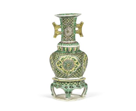 A RARE FAMILLE VERTE LOBED VASE AND STANDKangxiThe vase of oval hexafoil section, set with two crescent handles beneath the f