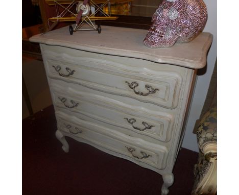 A French grey painted three drawer commode chest having white metal handles 