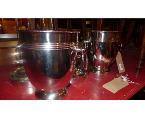 A pair of silver plated wine coolers with ring handles 