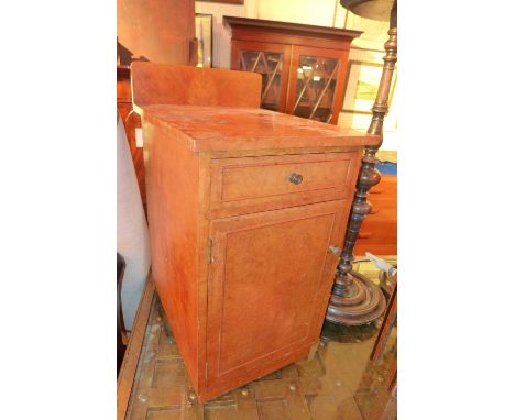 A pair of Art Deco maple bedside cabinets with slide out tops and fitted single drawer and a panel door on plinth bases