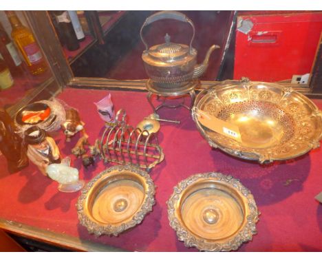 A collection of silver plated items including a pair of Shelfield wine coasters, a large pedestal bowl and a spirit kettle