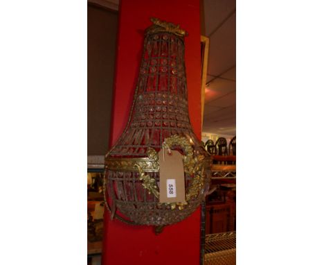 A gilt metal and cut glass basket form wall light