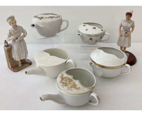 A collection of 5 antique ceramic feeding cups. Together with 2 figurines in the form of nurses. 