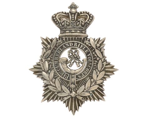 Badge. 1st Cumberland Rifle Volunteer Corps Victorian helmet plate circa 1878-80.  Good scarce die-stamped white metal crowne