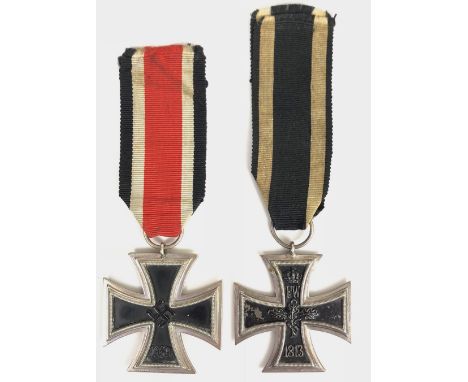 German Third Reich 1939 Iron Cross 2nd Class and Berlin made 1914 example.  A good example on ribbon with silvered frame and 