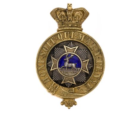 Bedfordshire Regiment Victorian Officer's glengarry badge circa 1881-96.  Good scarce die-stamped gilt Garter, domed black ve
