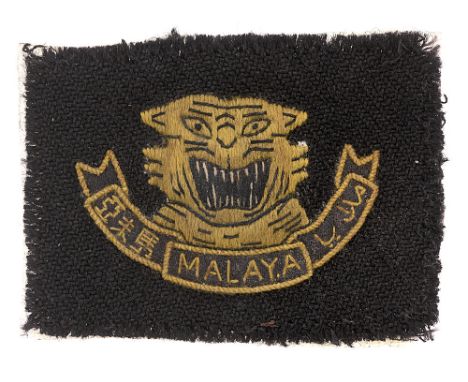 Malayan Peoples' Anti-Japanese Army WW2 cap badge.  Good rare 1942-45 locally well embroidered padded yellow tiger's head and