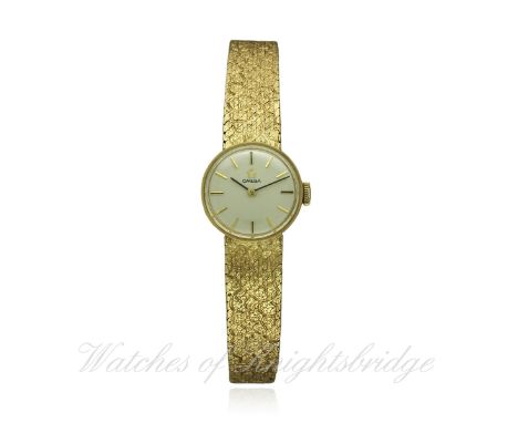 A LADIES 9CT SOLID GOLD OMEGA BRACELET WATCH CIRCA 1962, REF. 7II5606
D: Silver dial with gilt batons & hands. M: 17 jewel ma