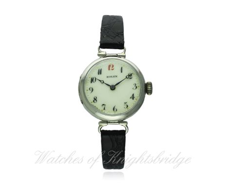 A LADIES SOLID SILVER ROLEX WRIST WATCH CIRCA 1920
D: White enamel dial with applied Arabic numerals, Breguet hands. M: Manua