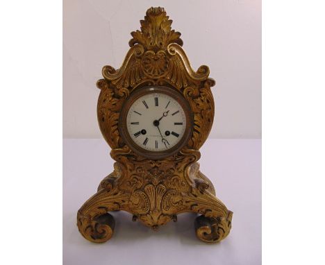 A French gilded metal mantle clock, white enamel dial with Roman numerals and two train movement