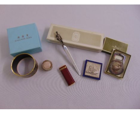 A quantity of white metal to include a paper knife with a figure of a jockey, a silver box set with rose quartz, a small pict