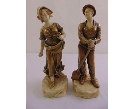 A pair of continental ceramic figurines of a farm boy and girl on naturalistic plinths