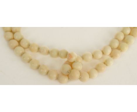 Lady's Vintage Angelskin Coral Bead and 14 Karat Yellow Gold Two Strand Necklace. Clasp Signed 14K. Beads Measure 9.5mm. Neck