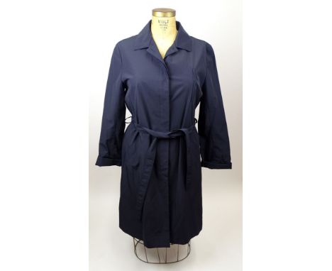 From a Palm Beach Socialite, A Dana Buchman Trench Coat. Nylon and Cotton. Labeled. Size M. Good Condition. Shipping $65.00