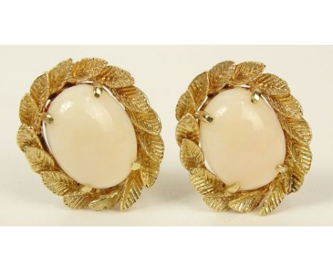 Lady's Vintage Angelskin Coral and 14 Karat Yellow Gold Earrings. Signed 14K. Good Condition. Measure 1 Inch by 3/4 Inch. Shi
