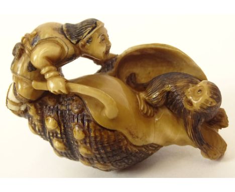 Well Carved Ivory Antique Japanese Netsuke. Depicting a Man and Monkey on Conch Shell. Signed. Good Condition. Measures 1-1/2