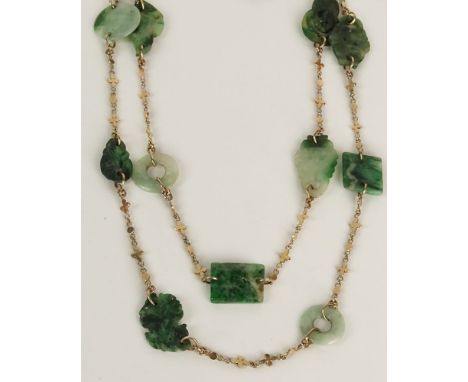 Lady's Vintage Carved Jade and 14 Karat Yellow Gold Necklace. Unsigned. Good Condition. Jades Measure approx. 7/8 Inch by 5/8