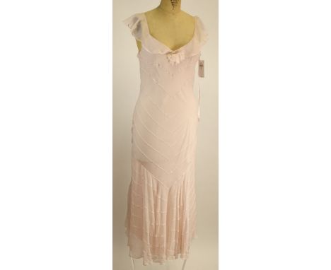 From a Palm Beach Socialite, A Ralph Lauren Light Pink 100% Silk Gown. Labeled: Ralph Lauren. Size 12. Good Condition. Measur