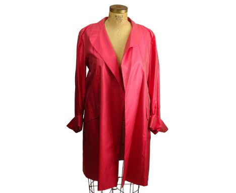 From a Palm Beach Socialite, A Giorgio Armani Coral Silk Trench Coat. Lines. Sash Belt. Labeled Giorgio Armani Made In Italy.