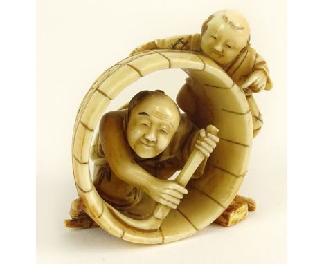 Well Done Antique Japanese Ivory Netsuke. "Barrel Makers" Unsigned. Good Condition. Measures 2 Inches Tall. This item will on