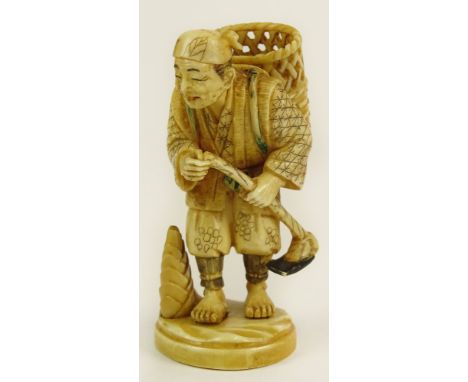 Antique Japanese Ivory Netsuke. Depicts Man with Basket and Hoe. Signed. Good Condition. Measures 2-3/8 Inches Tall. This ite