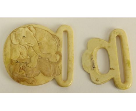 Vintage Ivory Belt Buckle. "Elephant and Lion" Unsigned. Good Vintage Condition. Measures 2-1/4 Inch Tall, 3 Inches Length. T