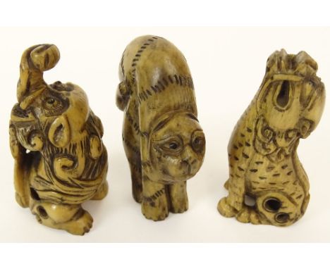 Lot of Three (3) Hand Carved and Stained Ivory Antique Japanese Netsuke. This Lot Includes A Cat with Arched Back, A Mythical