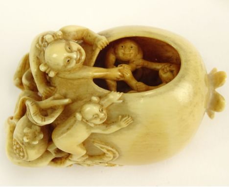 Extremely Well Done Antique Chinese Ivory Netsuke. Depicts Figures Climbing a Pomegranate and reaching Inside to Pull out Thr
