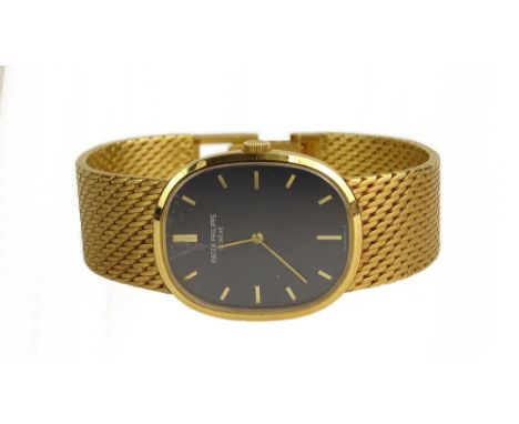Vintage Patek Philippe 18 Karat Yellow Gold Manual Movement Golden Ellipse Watch with Blue Baton Dial. Model #3748/1, Serial 