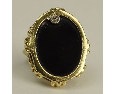 Lady's Vintage 14 Karat Yellow Gold and Black Onyx Ring with small accent Diamond. Signed 14K. Minor Surface Wear from Normal