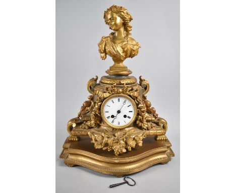 A French Gilt Decorated Spelter Mantel Clock with Maiden Head Finial and Relief Floral Swags Either Side and Beneath Barrel M