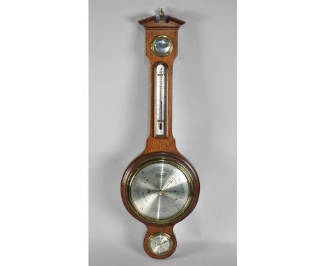 A Mid 20th Century Wheel Barometer with Thermometer by Comitti of London, 72cms High 
