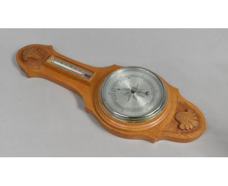 A Modern Carved Wooden Wheel Barometer/Thermometer, 49cms High 
