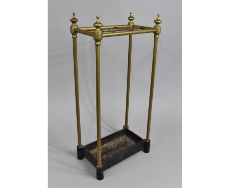 A Late Victorian/Edwardian Brass Six Division Stick Stand with Cast Iron Drip Tray, 31cms Wide and 64cms High