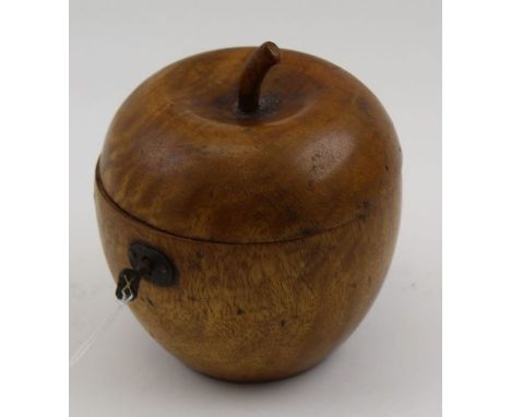 A Georgian design fruitwood apple for tea caddy, the hinged cover reveals silvered interior, fitted lock with key, 12cm high