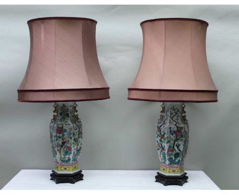 A pair of 20th century Chinese famille rose porcelain table lamp bases, hexagonal form decorated with birds &amp; blossoms wi