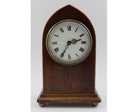 An Edwardian mahogany lancet cased mantel timepiece, with white enamel dial having Roman numerals, 8-day movement, 22cm high