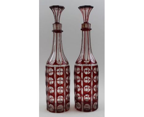 A pair of 19th century ruby flashed bottle decanters with stoppers, 34.5cm overall