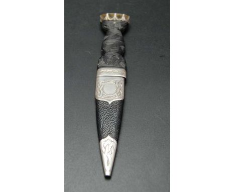 Thomas Kerr Ebbutt, a Scottish skean dhu dagger, having carved wood handle inset Citrine stone, the scabbard silver mounted, 