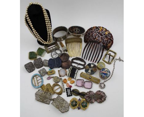 A collection  of decorative buckles and costume jewellery, includes a pair of bright cut steel shoe buckles, a gilt and ename